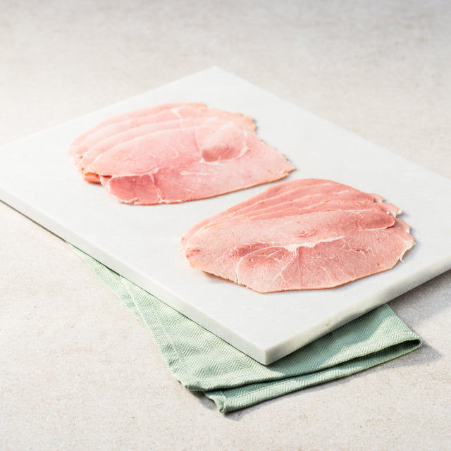 Sliced ham on a chopping board